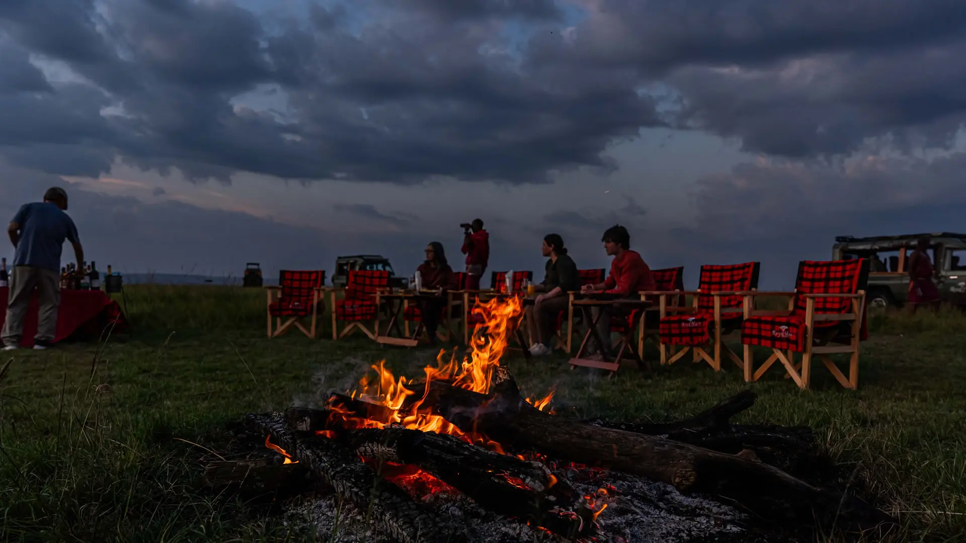 A bush dinner laid out at dusk