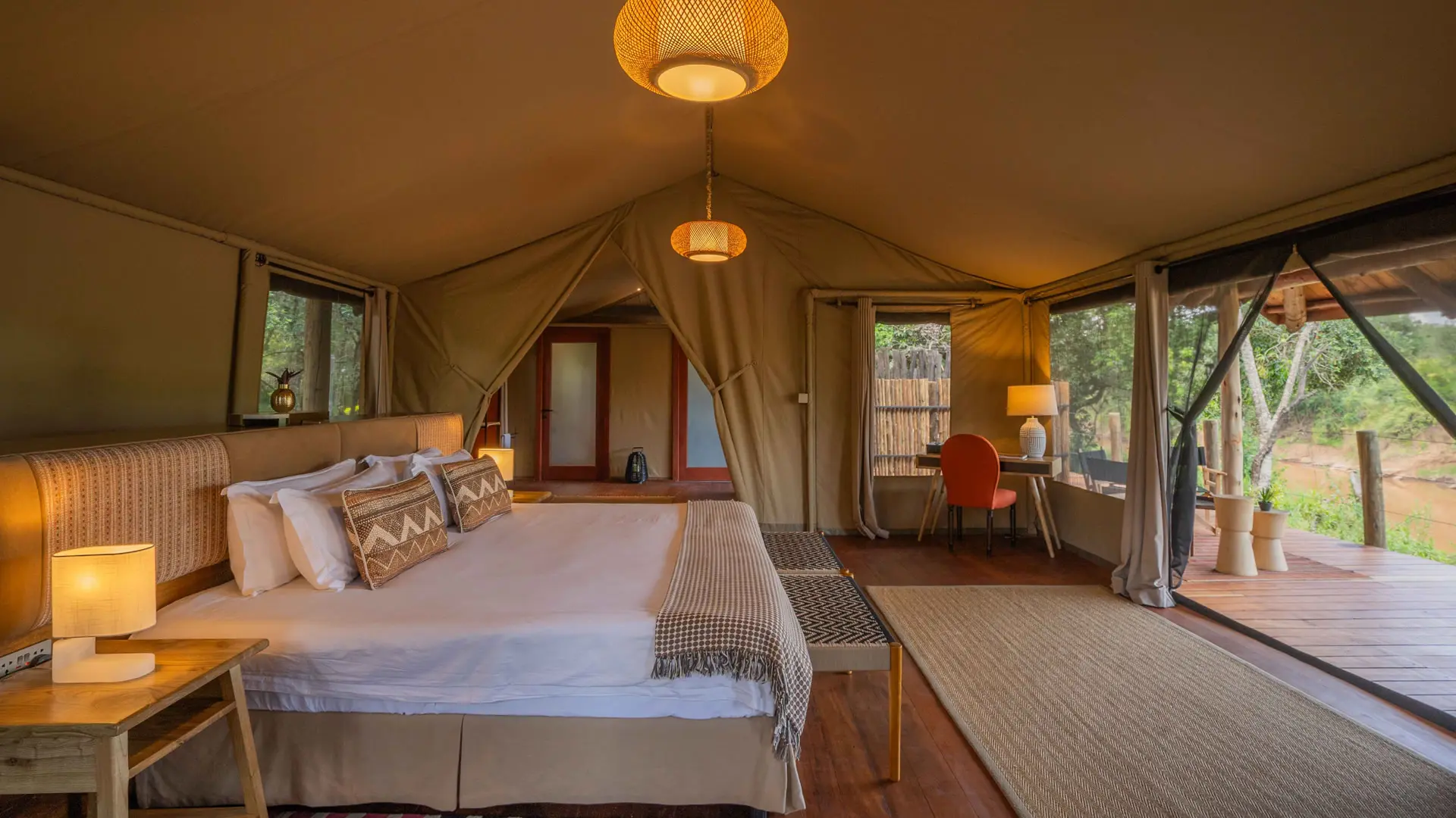 A river suite bedroom opening directly onto its private deck