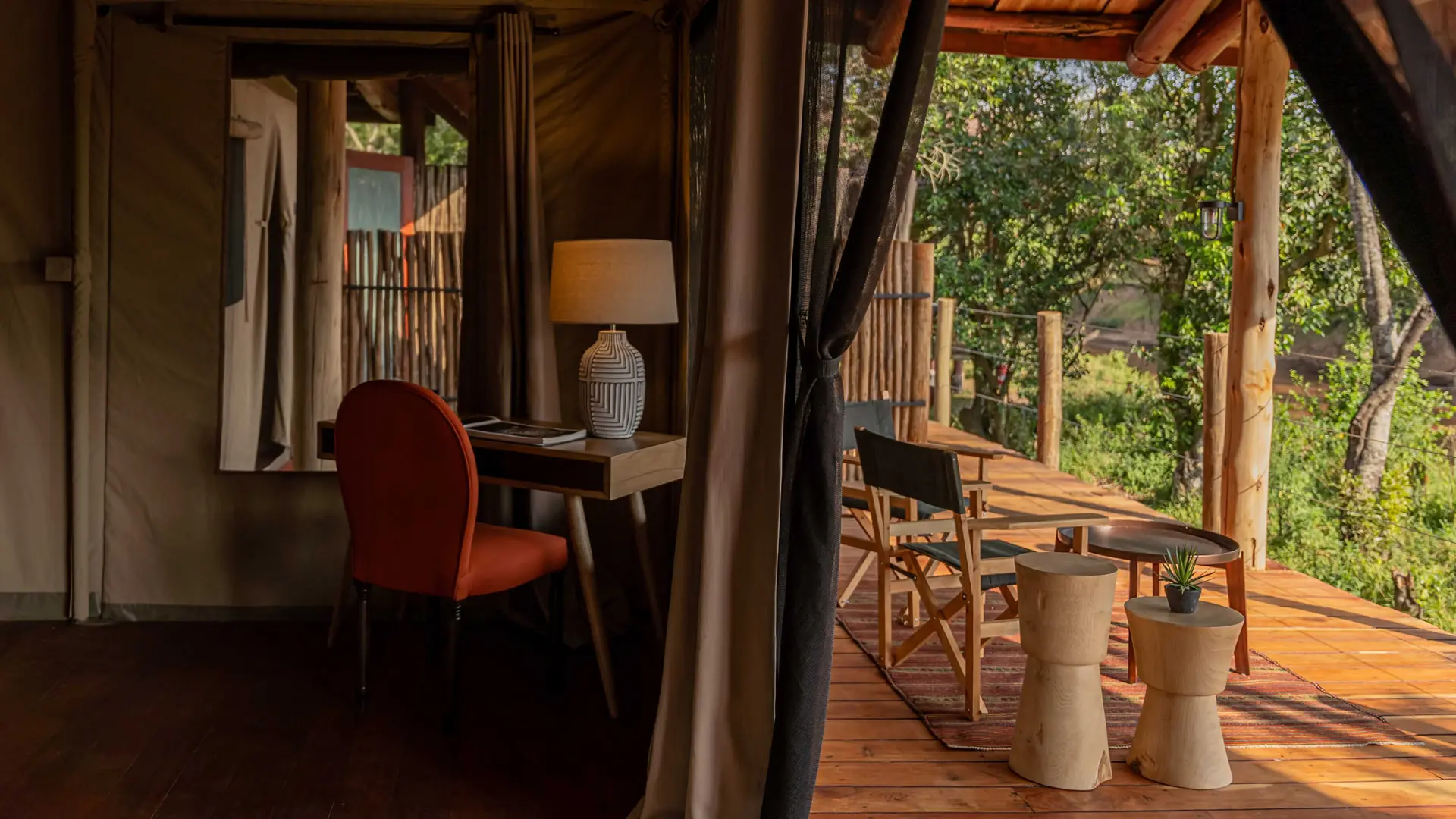 The writing desk and sitting area of a river suite, open to the deck